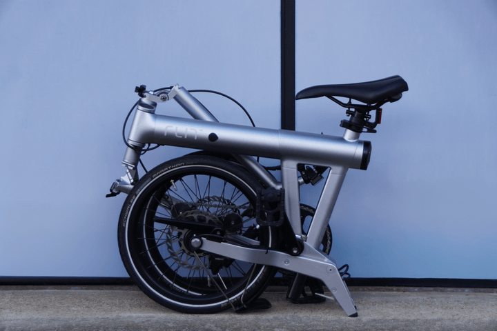 FLIT M2 folded, rolling on its own wheels. Image credit: FLIT